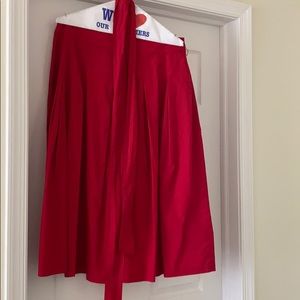 Red pleated A-line skirt with sash. Great for work